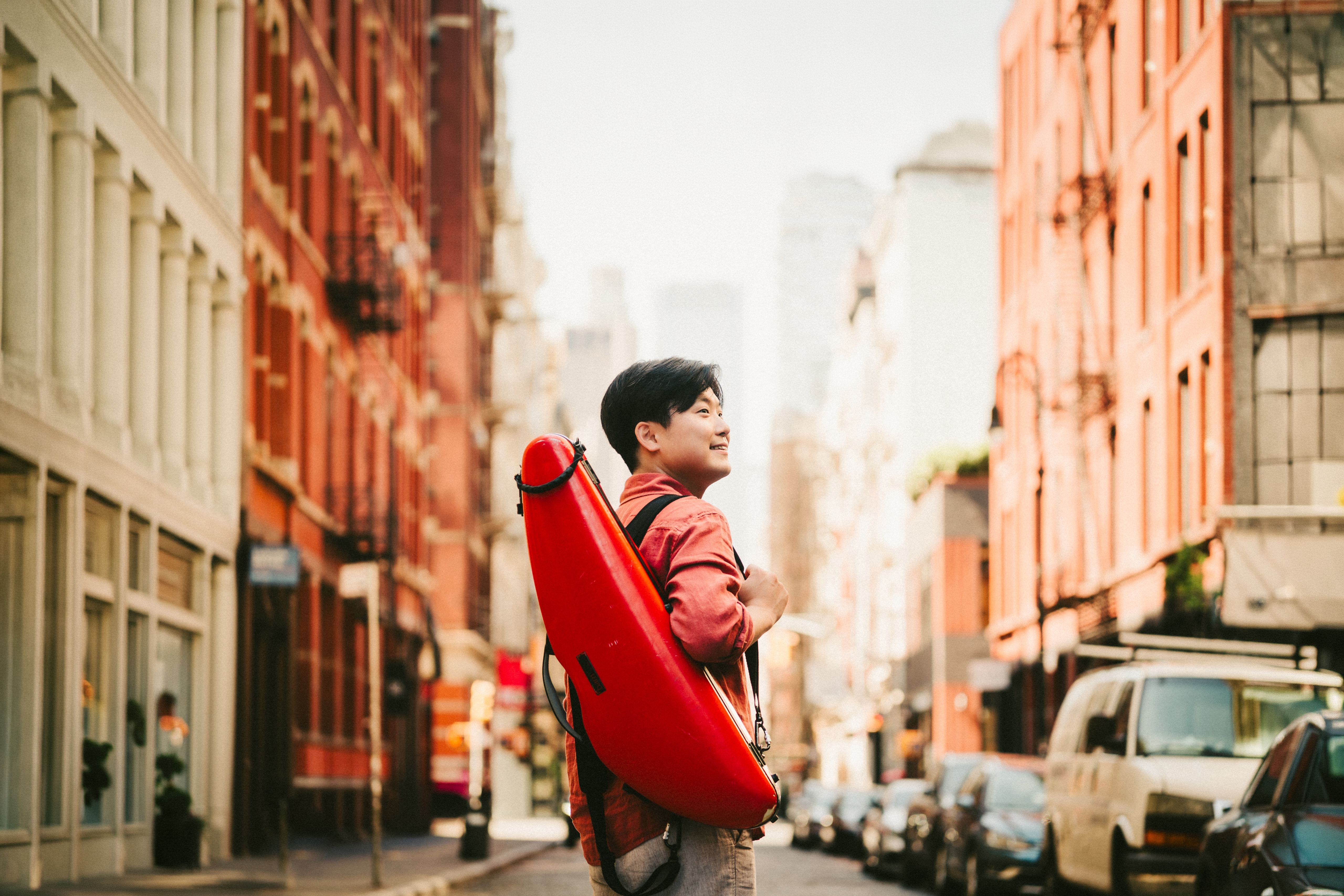 Siwoo Kim with his violin case on a SoHo street